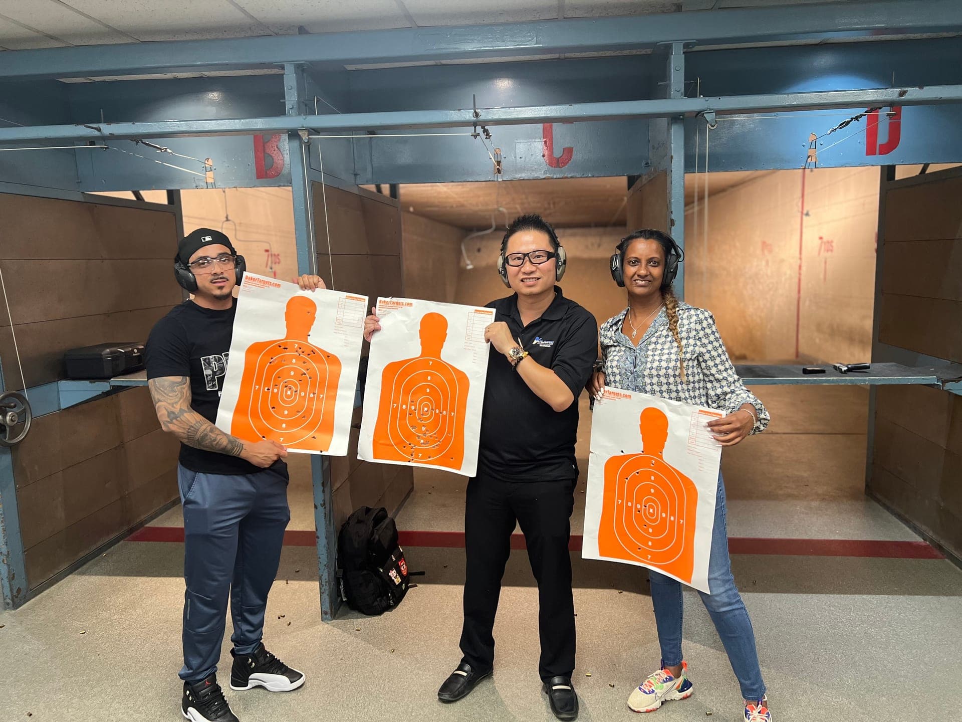 Group of students with orange targets at the firing range