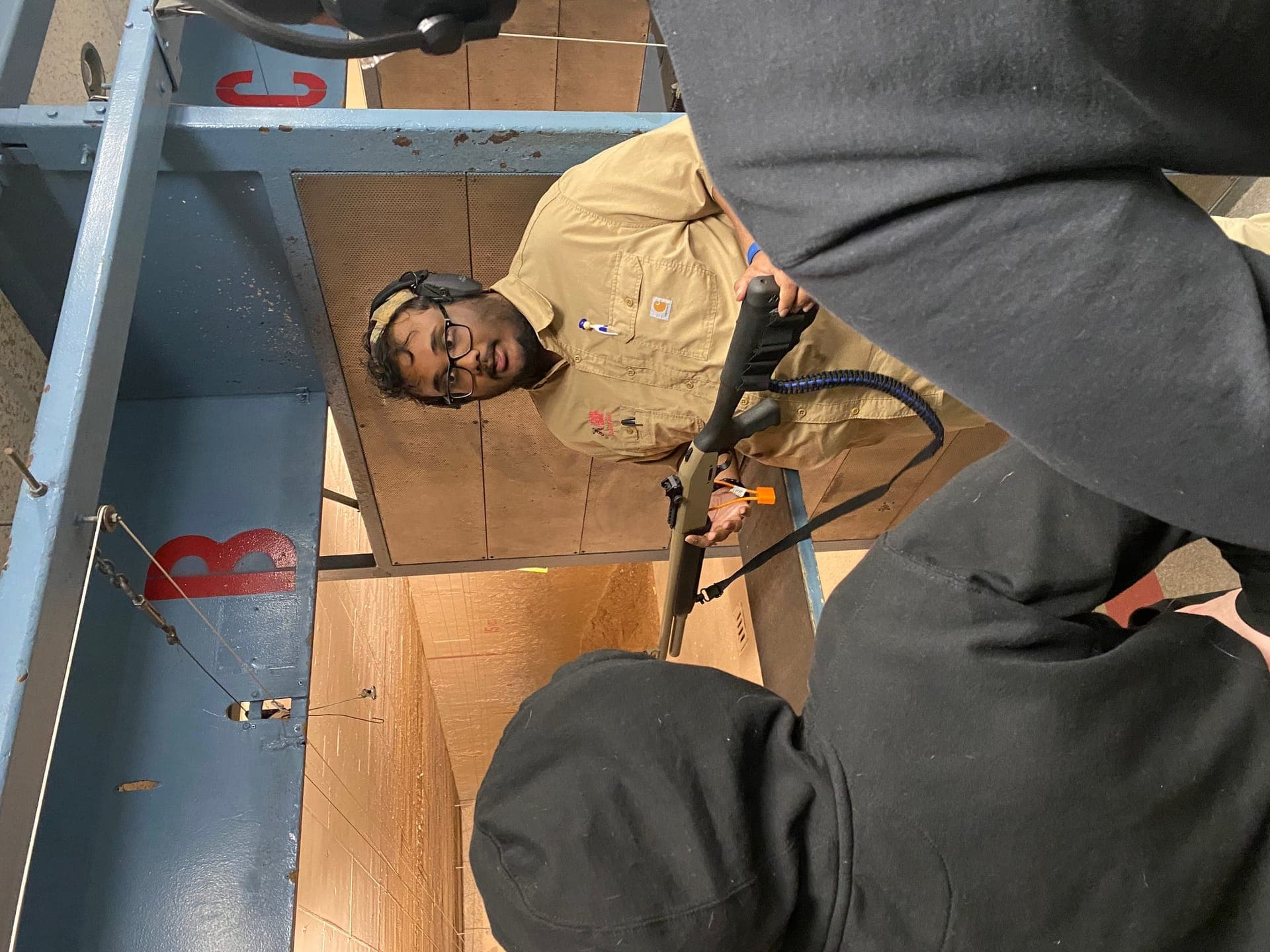 Shotgun demonstration with students at the firing range