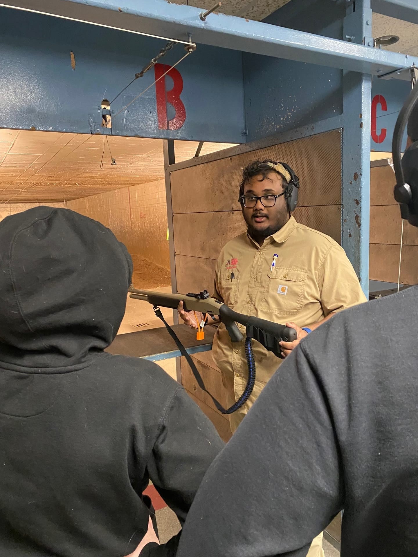 Shotgun demonstration with students at the range