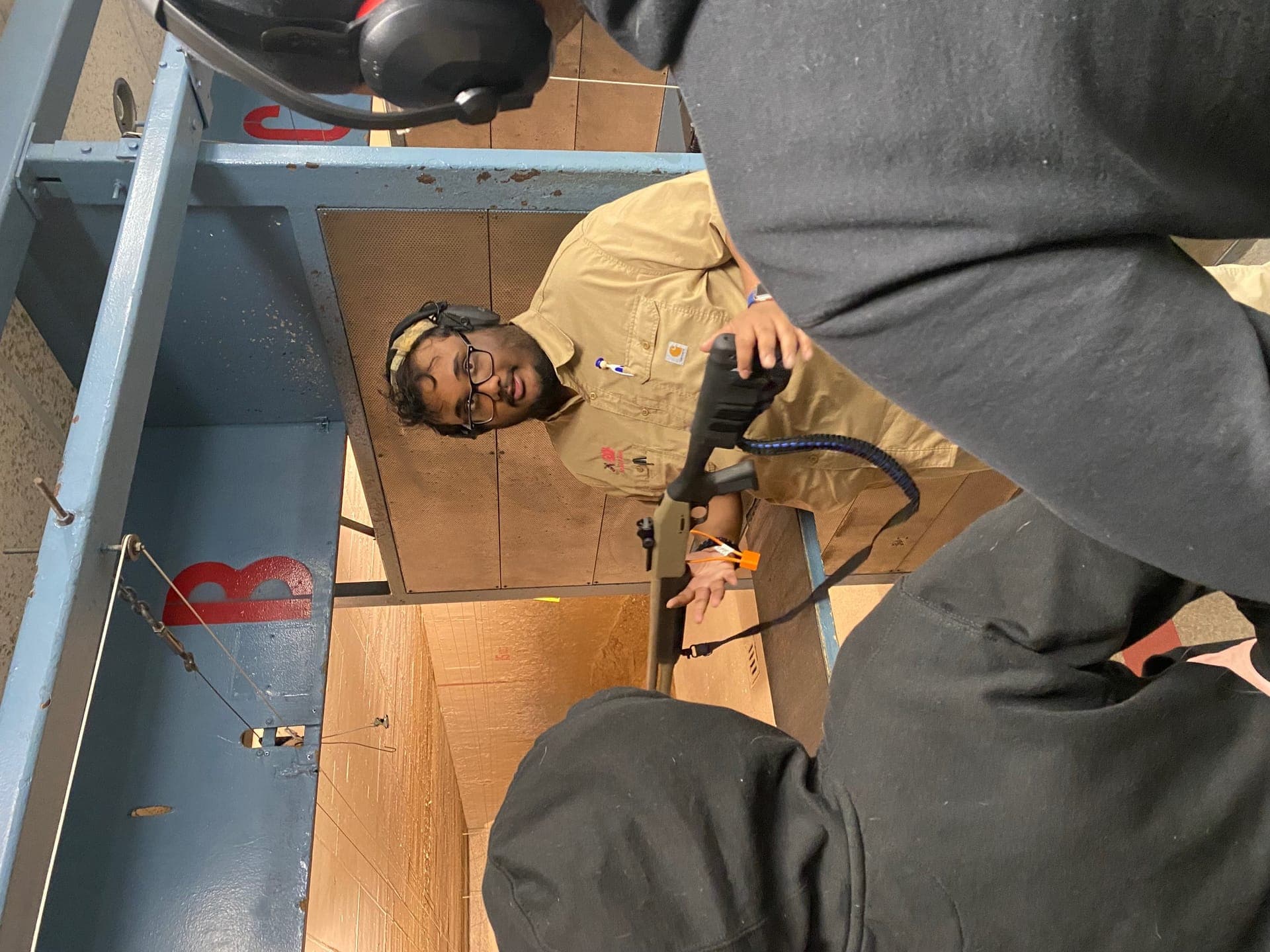 Hands-on shotgun safety instruction at the range