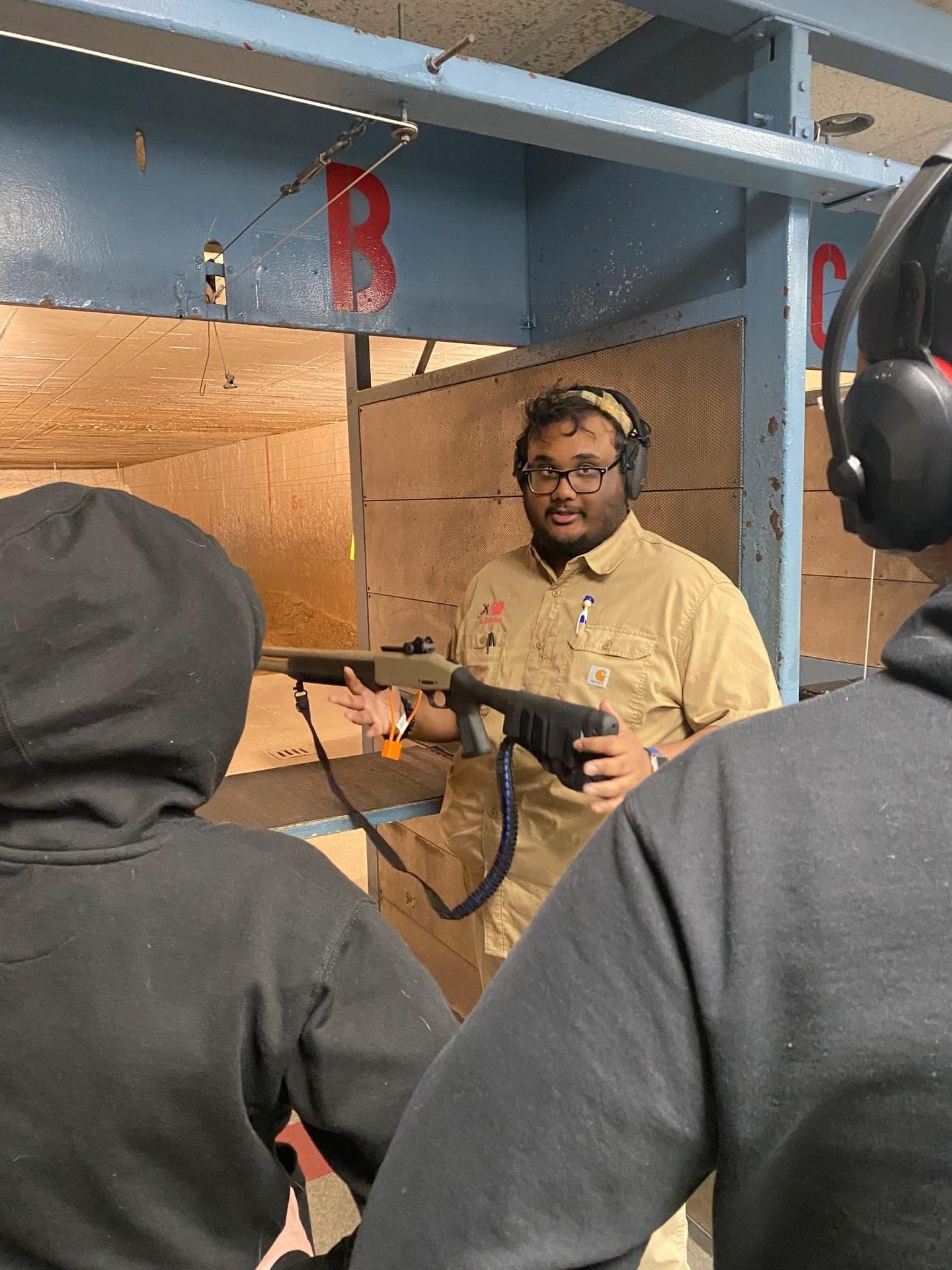 Hands-on shotgun safety instruction at the range
